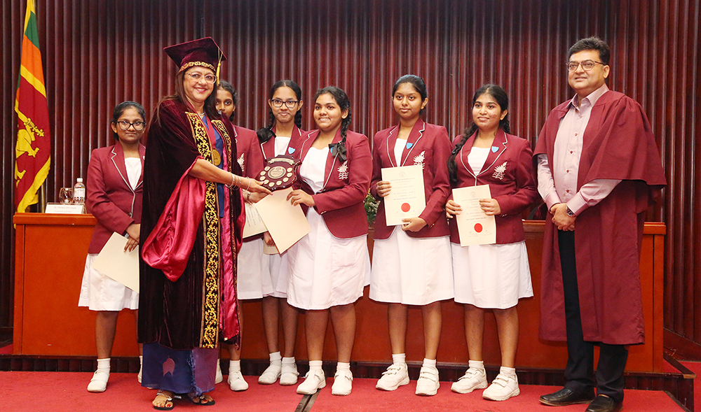 School children receiving the All-Island Interschool Chemistry Quiz competition prizes from Prof. Liyanage and Prof. Mukherjee