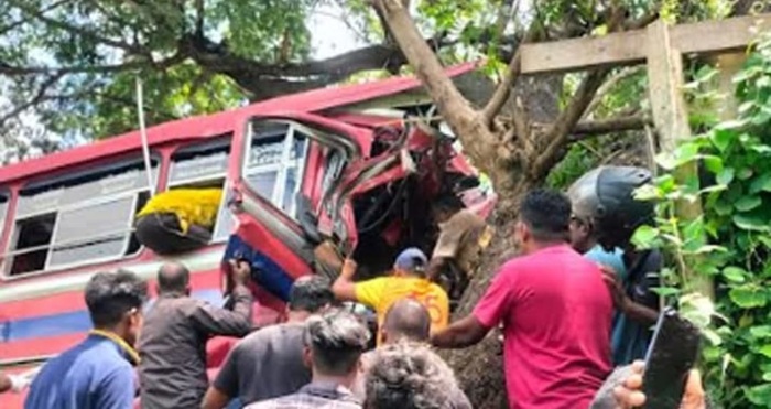 Bus veers off road and crashes into a tree