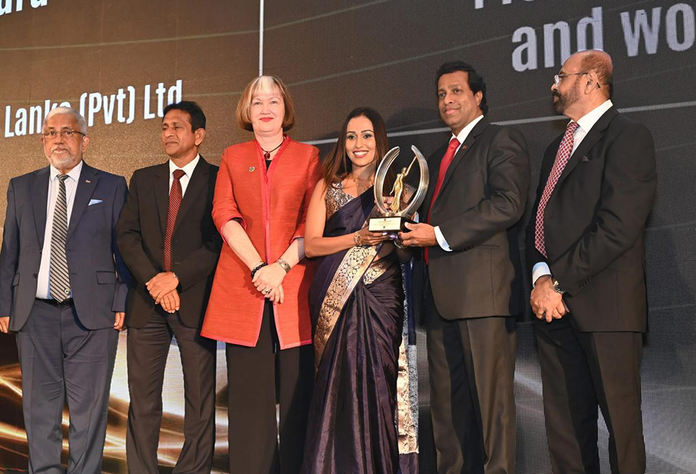 Kaushala Amarasekara receives her award from Pradeep Saputhanthri, Secretary to the Prime Minister (second from right). Also pictured (from left): Admiral Thisara Samarasinghe, Former High Commissioner of Sri Lanka to Australia and Former Commander of the Sri Lanka Navy; Aruna Bandara, Secretary, Ministry of Youth Affairs and Sports; Ms. Joni Simpson, Country Director, International Labour Organisation Office in Sri Lanka; and Anura Siriwardena, Chairman, Global CEO Forum and Managing Director, Voice of Asia Network (far right).