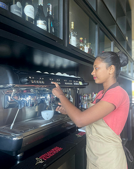 Vishmi making coffee at Hilton Yala Resort