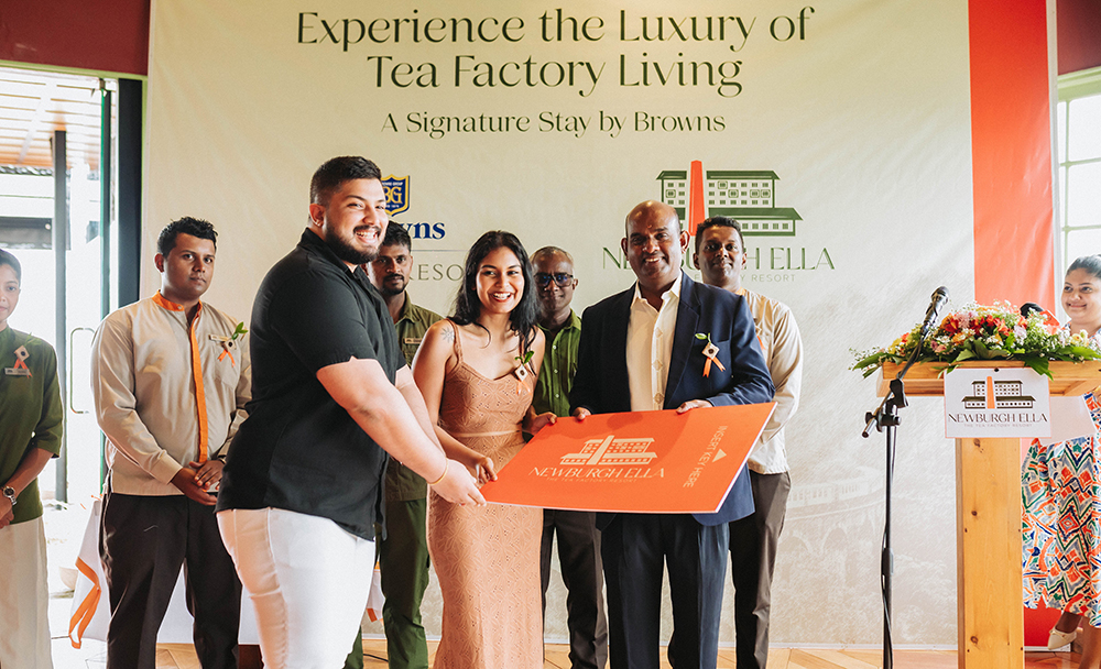 Gangadaran Welasamy, General Manager of Newburgh Ella and resort team marking the special occasion of having their first guest Mr and Mrs Amarasinghe