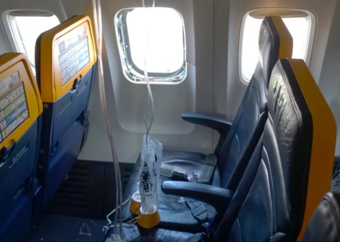 Engine debris shattered Ryanair window, pulling passenger out, NTSB says