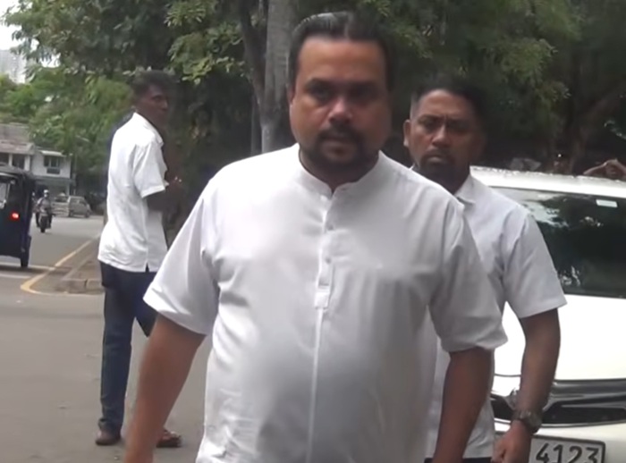Wimal Weerawansa arrives in court after arrest warrant issued